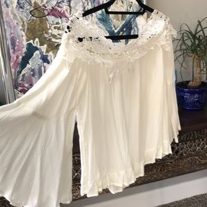 White, lace collared off-shoulder top.